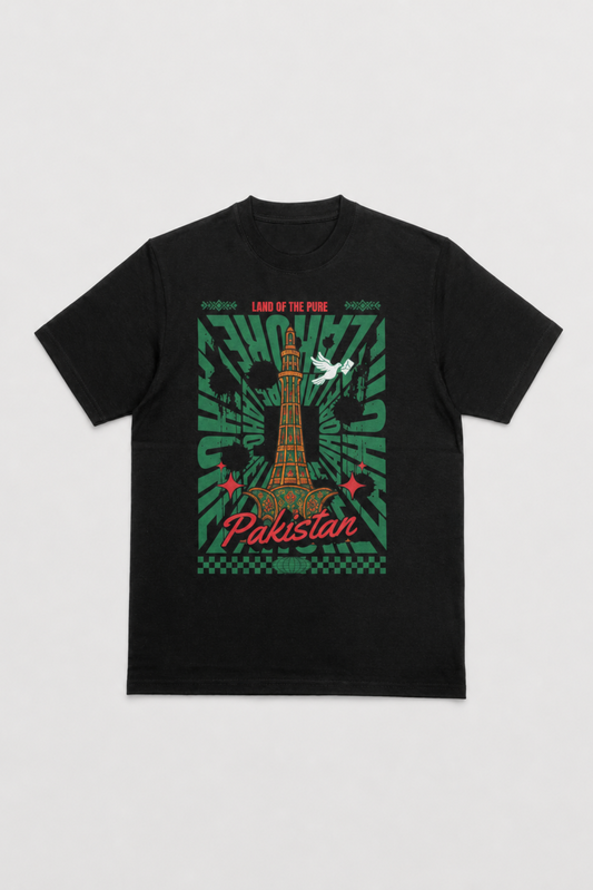 A black short-sleeve t-shirt with a graphic print on the front featuring the Taj Mahal, green sunburst patterns, and the text 'LOVE OF PINK' and 'Pakistan' in red, displayed against a light gray background.